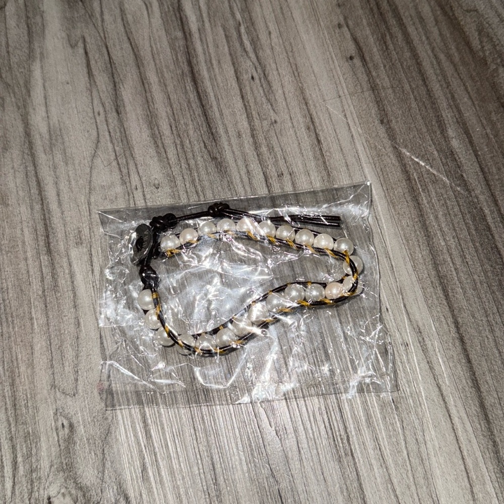 New Aqua Pura white beaded bracelet